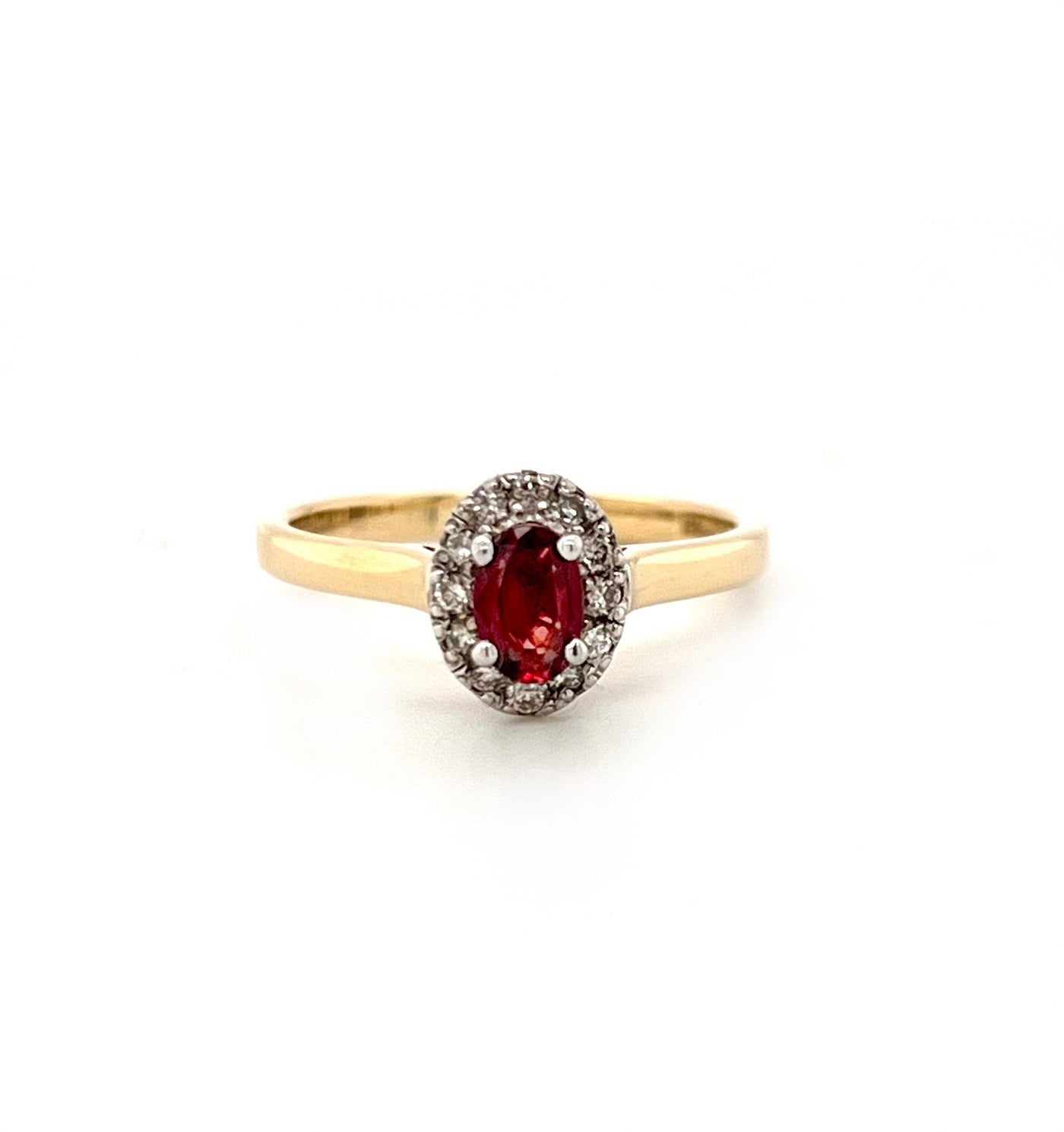 Oval Ruby and diamond halo ring
